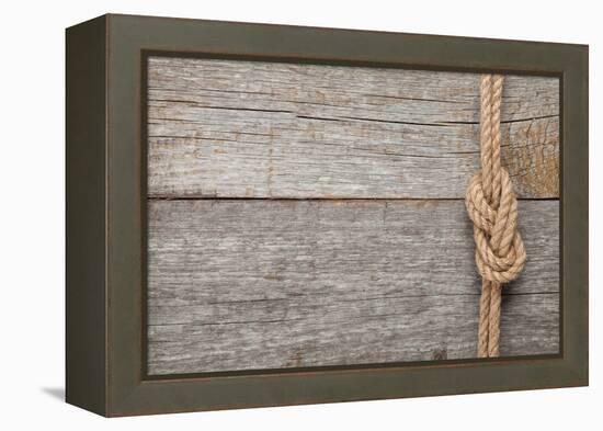 Ship Rope Knot on Old Wooden Texture Background-karandaev-Framed Premier Image Canvas