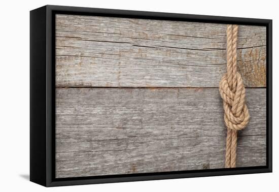 Ship Rope Knot on Old Wooden Texture Background-karandaev-Framed Premier Image Canvas