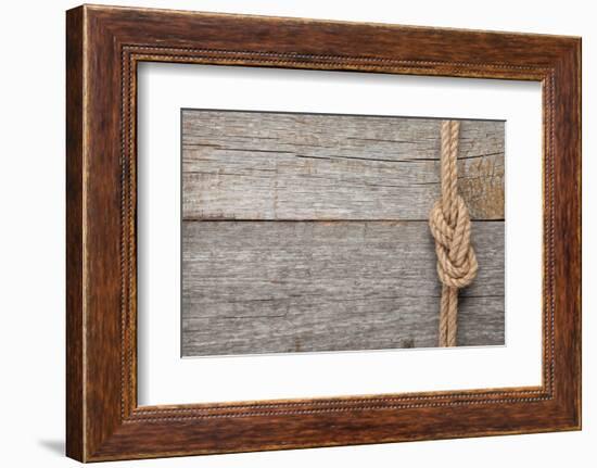 Ship Rope Knot on Old Wooden Texture Background-karandaev-Framed Photographic Print