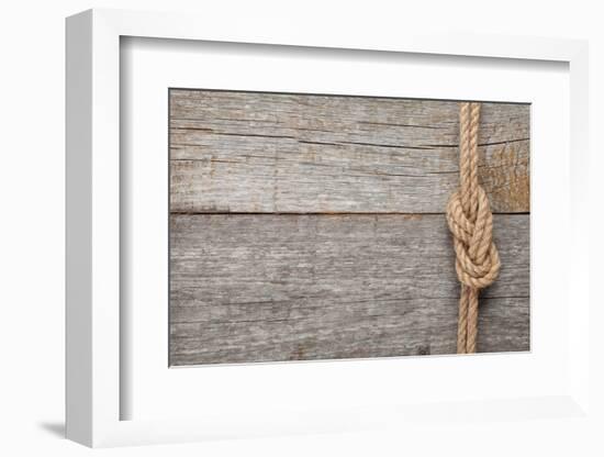 Ship Rope Knot on Old Wooden Texture Background-karandaev-Framed Photographic Print