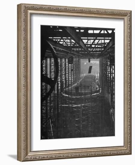 Shipbuilding, 10,000 Ton Merchantman Frames on Overhead Trolley Crane Dropping Plate into Position-William Vandivert-Framed Photographic Print