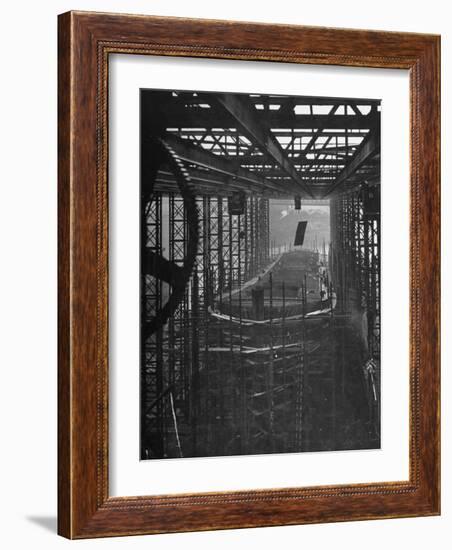 Shipbuilding, 10,000 Ton Merchantman Frames on Overhead Trolley Crane Dropping Plate into Position-William Vandivert-Framed Photographic Print