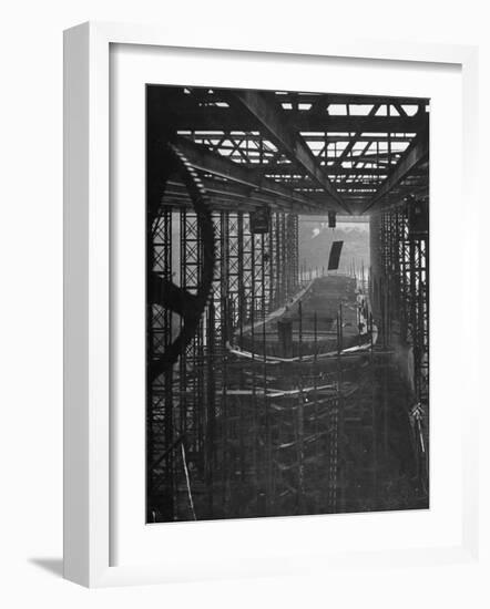 Shipbuilding, 10,000 Ton Merchantman Frames on Overhead Trolley Crane Dropping Plate into Position-William Vandivert-Framed Photographic Print