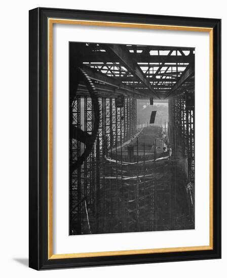 Shipbuilding, 10,000 Ton Merchantman Frames on Overhead Trolley Crane Dropping Plate into Position-William Vandivert-Framed Photographic Print