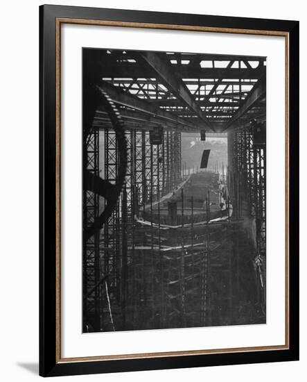 Shipbuilding, 10,000 Ton Merchantman Frames on Overhead Trolley Crane Dropping Plate into Position-William Vandivert-Framed Photographic Print