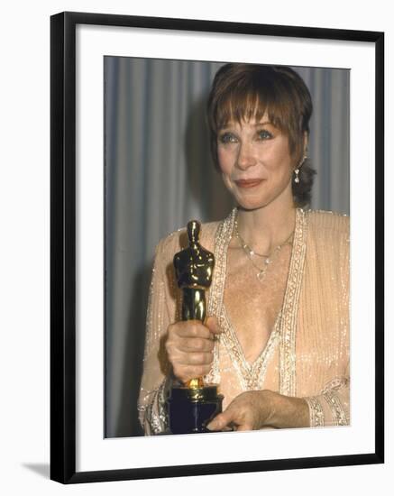 Shirley MacLaine Holding Her Oscar in Press Room at Academy Awards-John Paschal-Framed Premium Photographic Print