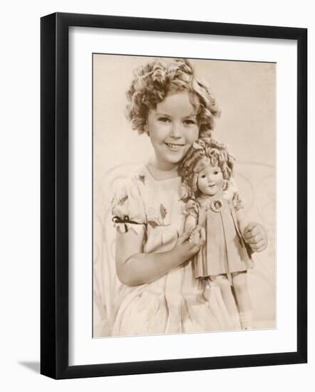 Shirley Temple American Child Star of the 1930s Seen Here with a Shirley Temple Doll-null-Framed Photographic Print