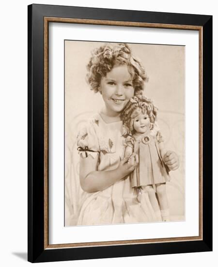 Shirley Temple American Child Star of the 1930s Seen Here with a Shirley Temple Doll-null-Framed Photographic Print