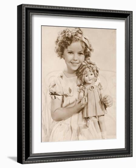 Shirley Temple American Child Star of the 1930s Seen Here with a Shirley Temple Doll-null-Framed Photographic Print