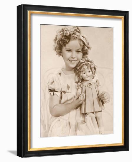 Shirley Temple American Child Star of the 1930s Seen Here with a Shirley Temple Doll-null-Framed Photographic Print