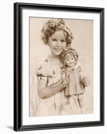 Shirley Temple American Child Star of the 1930s Seen Here with a Shirley Temple Doll-null-Framed Photographic Print