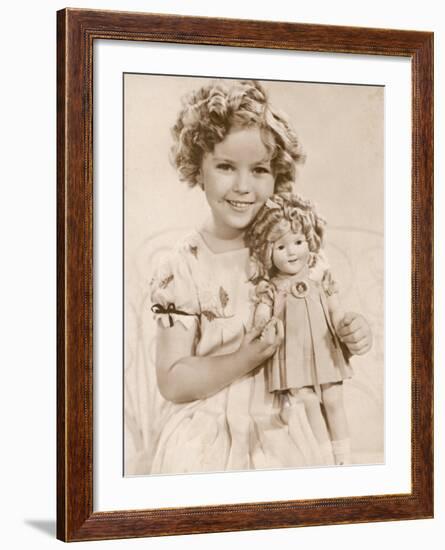 Shirley Temple American Child Star of the 1930s Seen Here with a Shirley Temple Doll-null-Framed Photographic Print