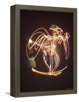 Shirtless Artist Pablo Picasso Creating Light Drawing of Vase of Flowers-Gjon Mili-Framed Premier Image Canvas