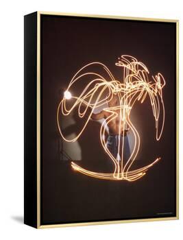Shirtless Artist Pablo Picasso Creating Light Drawing of Vase of Flowers-Gjon Mili-Framed Premier Image Canvas