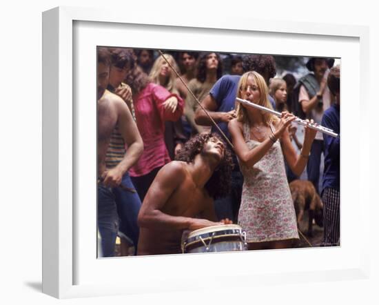 Shirtless Male Drummer and Dress Wearing Female Flutist Jamming During Woodstock Music Festival-Bill Eppridge-Framed Photographic Print