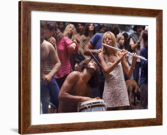 Shirtless Male Drummer and Dress Wearing Female Flutist Jamming During Woodstock Music Festival-Bill Eppridge-Framed Photographic Print