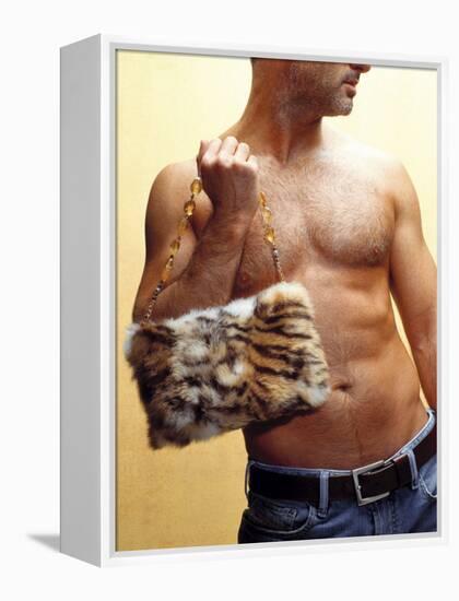 Shirtless Man Carrying an Animal Print Purse-Steve Cicero-Framed Premier Image Canvas