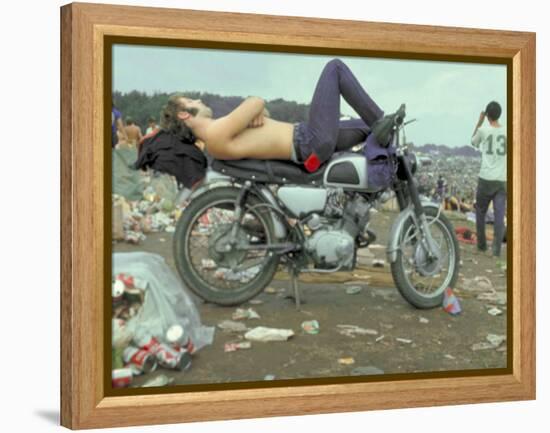 Shirtless Man in Levi Strauss Jeans Lying on Motorcycle Seat at Woodstock Music Festival-Bill Eppridge-Framed Premier Image Canvas