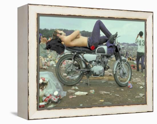 Shirtless Man in Levi Strauss Jeans Lying on Motorcycle Seat at Woodstock Music Festival-Bill Eppridge-Framed Premier Image Canvas