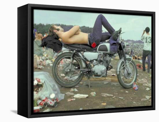 Shirtless Man in Levi Strauss Jeans Lying on Motorcycle Seat at Woodstock Music Festival-Bill Eppridge-Framed Premier Image Canvas