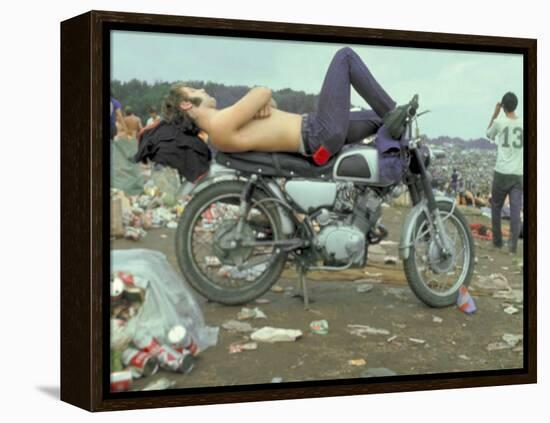 Shirtless Man in Levi Strauss Jeans Lying on Motorcycle Seat at Woodstock Music Festival-Bill Eppridge-Framed Premier Image Canvas