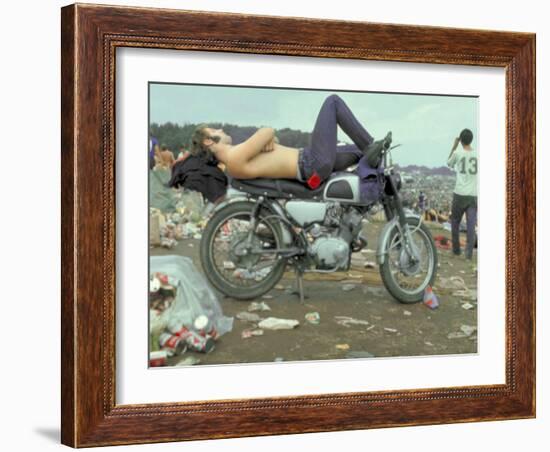 Shirtless Man in Levi Strauss Jeans Lying on Motorcycle Seat at Woodstock Music Festival-Bill Eppridge-Framed Photographic Print