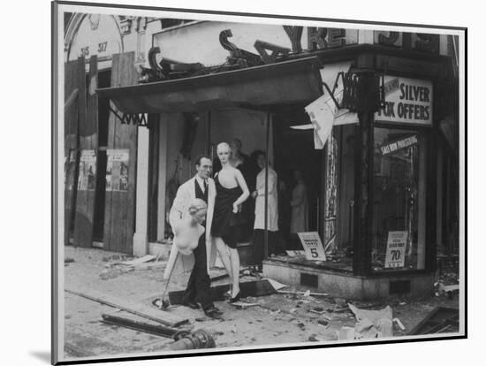 Shop Owner Poses with Two Mannequins Following the Destruction of His Shop by German Bombers-null-Mounted Photographic Print