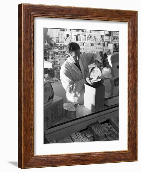 Shopkeeper Unpacking Canned Gammon Joints, Mexborough, South Yorkshire, 1963-Michael Walters-Framed Photographic Print