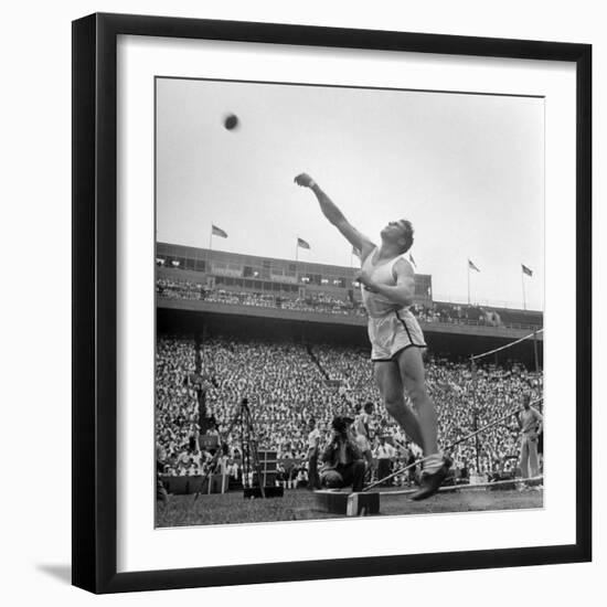 Shot Putter Francis Delaney in Mid-Throw in an Attempt to Qualify During the U.S. Olympic Tryouts-Ed Clark-Framed Premium Photographic Print