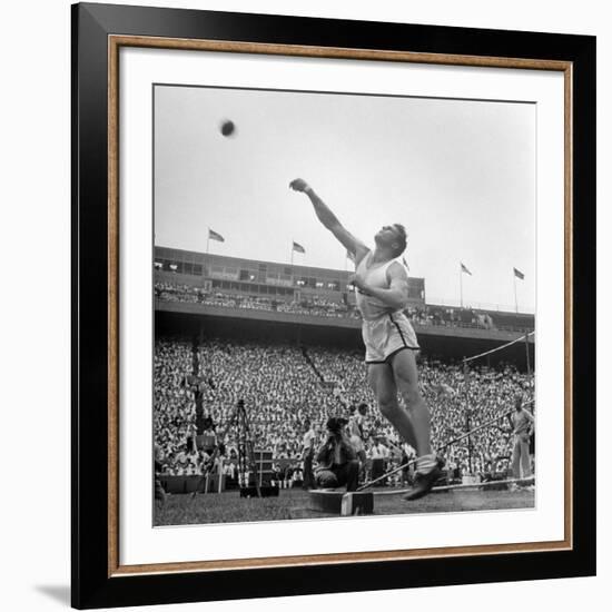 Shot Putter Francis Delaney in Mid-Throw in an Attempt to Qualify During the U.S. Olympic Tryouts-Ed Clark-Framed Premium Photographic Print