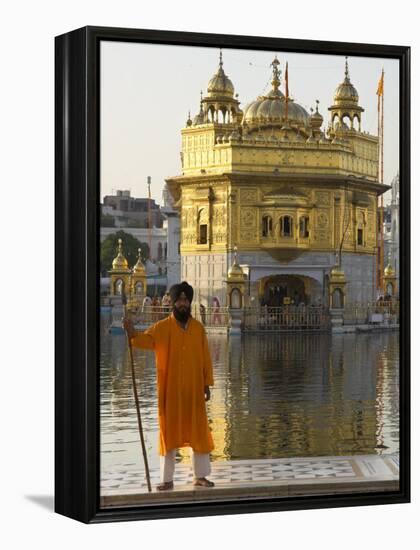 Shrine Guard in Orange Clothes Holding Lance Standing by Pool in Front of the Golden Temple-Eitan Simanor-Framed Premier Image Canvas