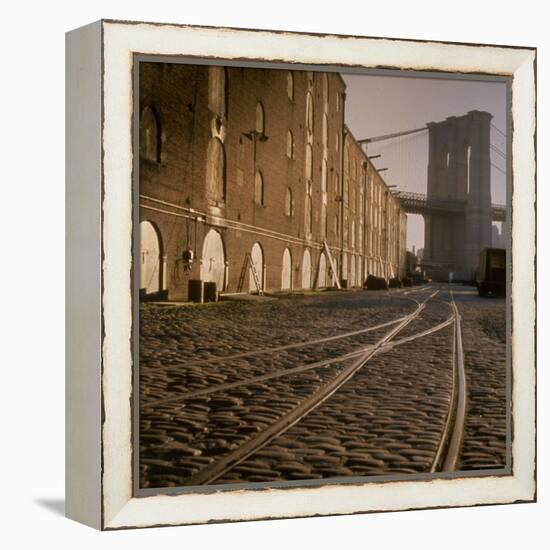 Shuttered Warehouses Lit by Sunlight on Trolley Track Railed Street Along Brooklyn Waterfront-Walker Evans-Framed Premier Image Canvas