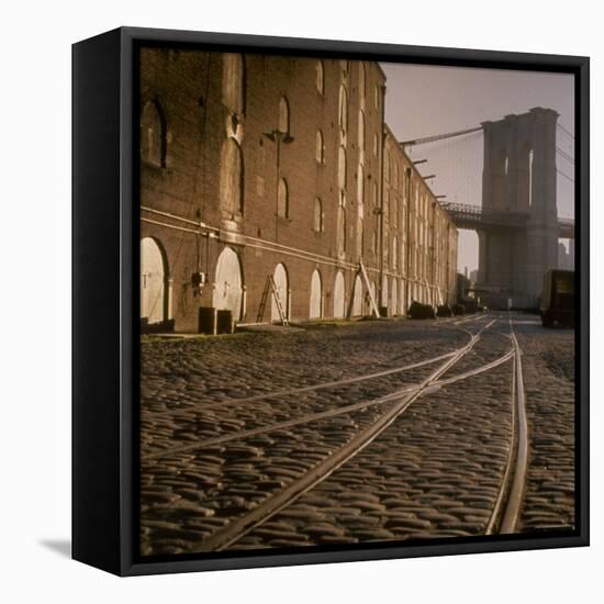 Shuttered Warehouses Lit by Sunlight on Trolley Track Railed Street Along Brooklyn Waterfront-Walker Evans-Framed Premier Image Canvas