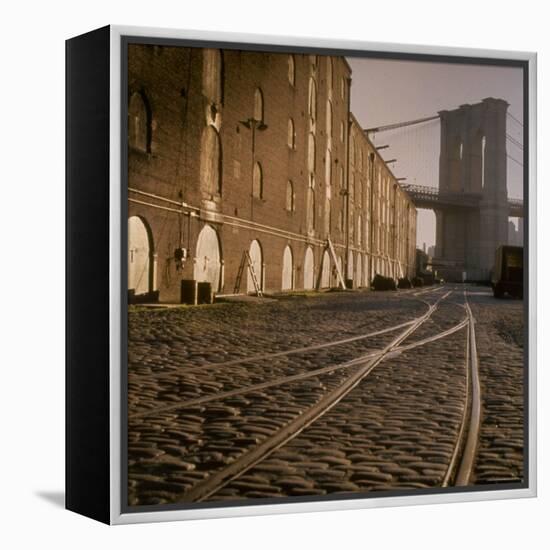 Shuttered Warehouses Lit by Sunlight on Trolley Track Railed Street Along Brooklyn Waterfront-Walker Evans-Framed Premier Image Canvas