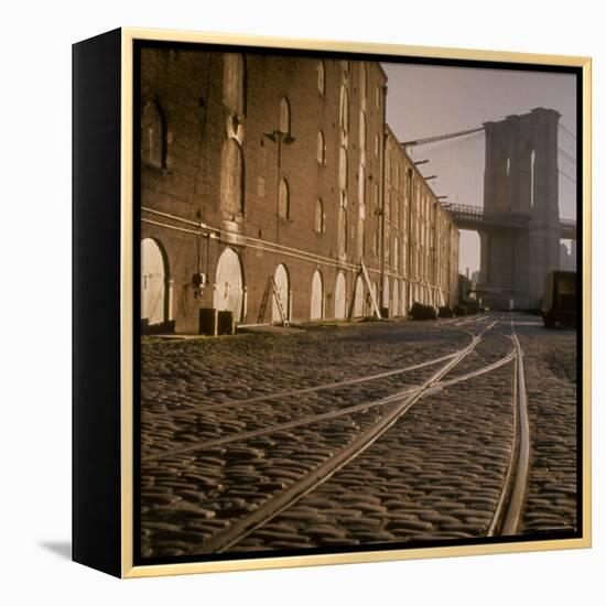 Shuttered Warehouses Lit by Sunlight on Trolley Track Railed Street Along Brooklyn Waterfront-Walker Evans-Framed Premier Image Canvas