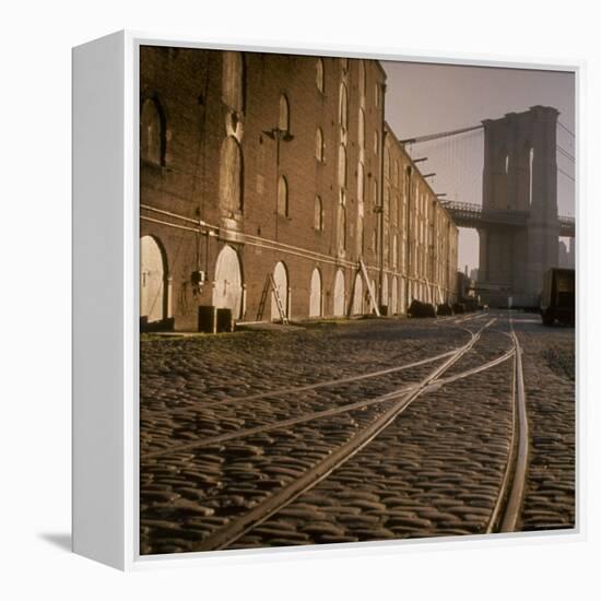 Shuttered Warehouses Lit by Sunlight on Trolley Track Railed Street Along Brooklyn Waterfront-Walker Evans-Framed Premier Image Canvas