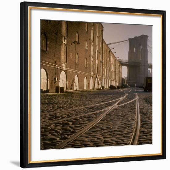 Shuttered Warehouses Lit by Sunlight on Trolley Track Railed Street Along Brooklyn Waterfront-Walker Evans-Framed Premium Photographic Print