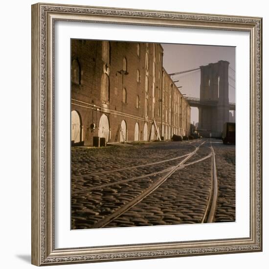 Shuttered Warehouses Lit by Sunlight on Trolley Track Railed Street Along Brooklyn Waterfront-Walker Evans-Framed Photographic Print