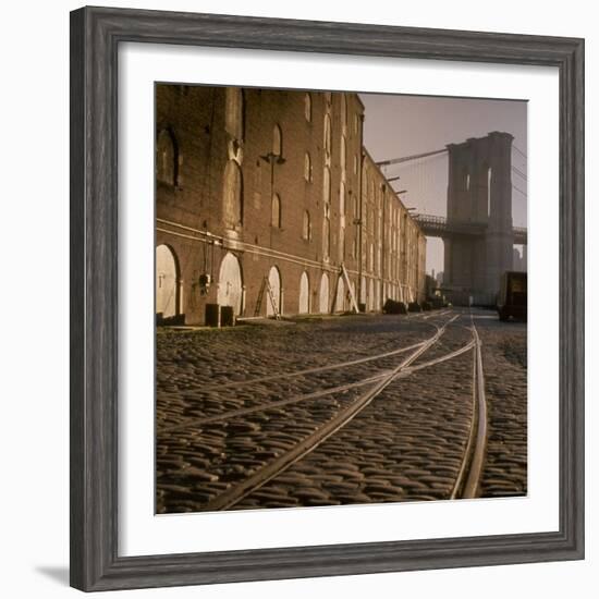 Shuttered Warehouses Lit by Sunlight on Trolley Track Railed Street Along Brooklyn Waterfront-Walker Evans-Framed Photographic Print