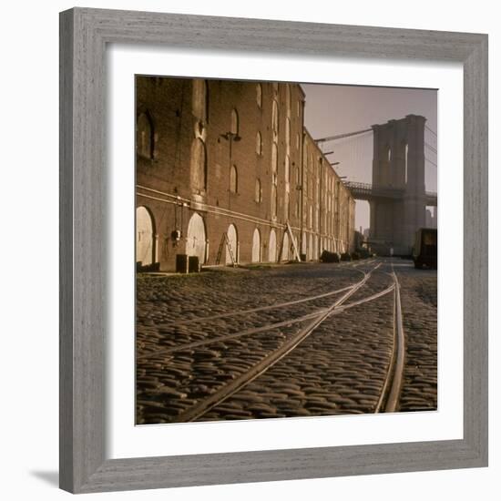 Shuttered Warehouses Lit by Sunlight on Trolley Track Railed Street Along Brooklyn Waterfront-Walker Evans-Framed Photographic Print