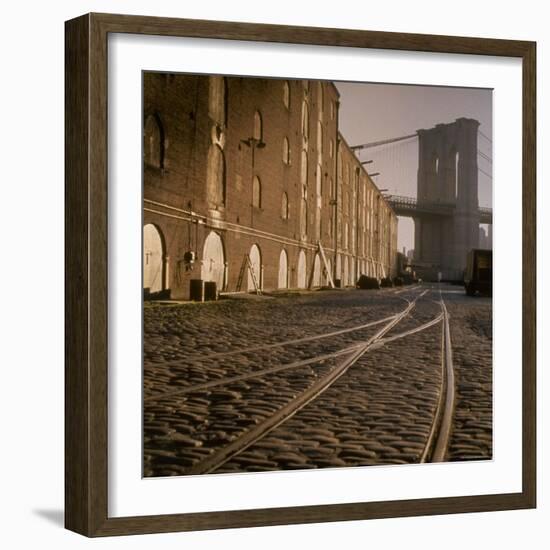 Shuttered Warehouses Lit by Sunlight on Trolley Track Railed Street Along Brooklyn Waterfront-Walker Evans-Framed Photographic Print