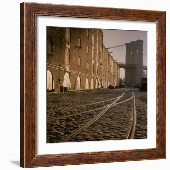 Shuttered Warehouses Lit by Sunlight on Trolley Track Railed Street Along Brooklyn Waterfront-Walker Evans-Framed Photographic Print