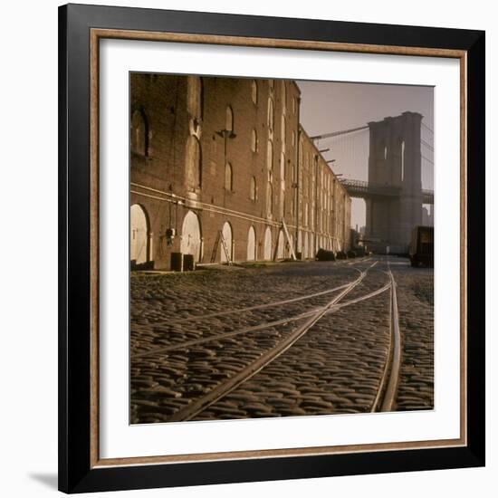 Shuttered Warehouses Lit by Sunlight on Trolley Track Railed Street Along Brooklyn Waterfront-Walker Evans-Framed Photographic Print