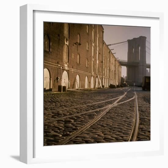 Shuttered Warehouses Lit by Sunlight on Trolley Track Railed Street Along Brooklyn Waterfront-Walker Evans-Framed Photographic Print