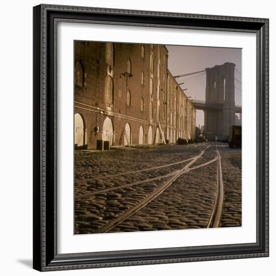 Shuttered Warehouses Lit by Sunlight on Trolley Track Railed Street Along Brooklyn Waterfront-Walker Evans-Framed Photographic Print