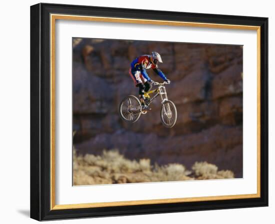 Side Profile of a Person on a Bicycle in Mid Air-null-Framed Photographic Print