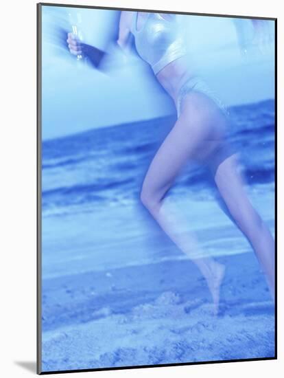 Side Profile of a Woman Running on the Beach-null-Mounted Photographic Print