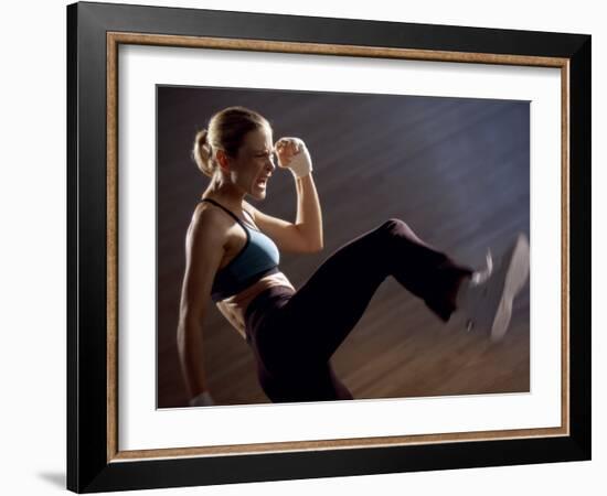 Side Profile of a Young Woman Kickboxing-null-Framed Photographic Print
