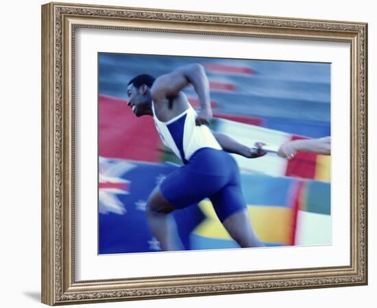 Side Profile of Runners Passing a Baton in a Relay Race-null-Framed Photographic Print