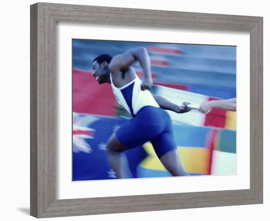 Side Profile of Runners Passing a Baton in a Relay Race-null-Framed Photographic Print